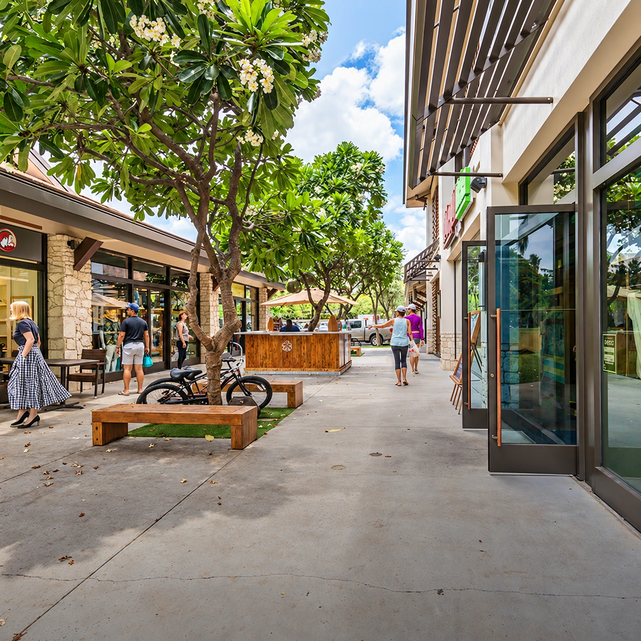 An open-air shopping center with landscaped walkways